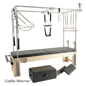 Pilates Cadillac Reformer with attachments on a white background