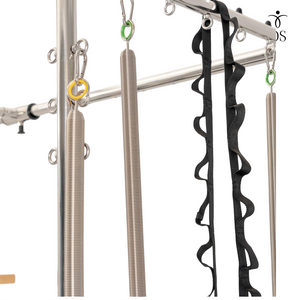 resistance springs on the Timber Cadillac Tower, featuring heavy-duty carabiner connections.