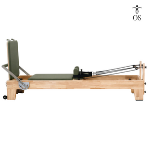 Side view of The Timber Reformer by Oshun Studios featuring a solid Oak wood frame and custom upholstery.