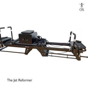 Industrial steel monorail track on the Jet Reformer ensuring a silent, friction-free glide under heavy resistance.