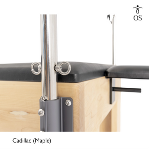 Close-up of the heavy-duty black mounting bracket connecting the stainless steel tower to the solid Maple frame of the Timber Cadillac.