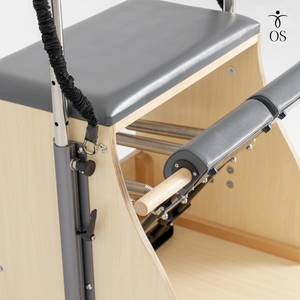 Maple wood locking bar connecting the pedals of the Timber Chair to create a unified foot bar for heavy resistance exercises.