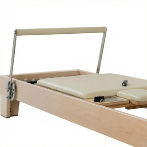 carriage platform on the Maple Timber Reformer featuring smooth-gliding rails and premium upholstery.