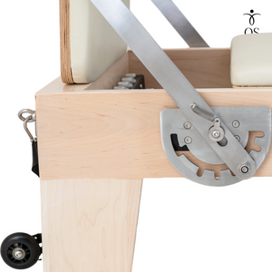 Adjustable locking foot bar on the Maple Timber Reformer with non-slip cover for stability.