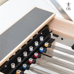 Close-up of the springs on the Maple Timber Reformer frame.