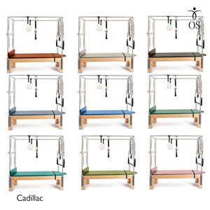 The Timber Cadillac in solid Maple. A professional Pilates Trapeze Table with a light wood finish and stainless steel tower.