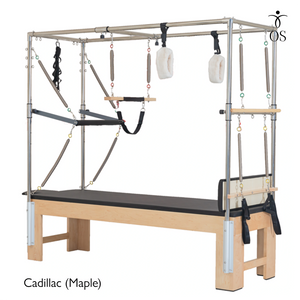 The Timber Cadillac in solid Maple. A professional Pilates Trapeze Table with a light wood finish and stainless steel tower.