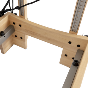 Detail view of the riser attachment on the Maple Timber Reformer for precise rope height adjustment.