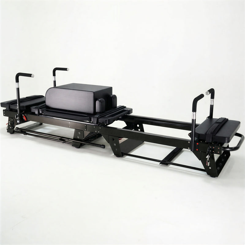 Oshun Jet Reformer in black with padded handlebars and a platform box, front angle view