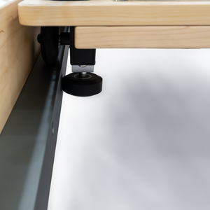 Precision carriage glide wheel on steel rails of the Oshun Studios Timber Reformer in natural Maple wood
