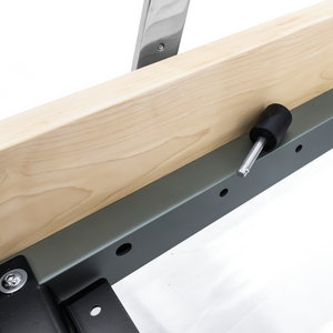 Steel rail with rubber stopper on the Oshun Studios Timber Reformer in Maple for smooth carriage travel