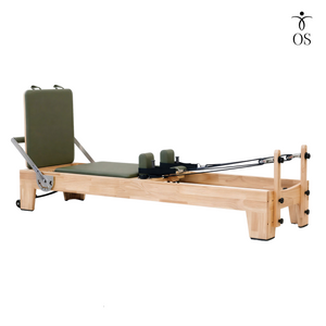 Full side profile view of the Timber Reformer in solid Oak, displaying the sleek frame design and sturdy low-profile stance.