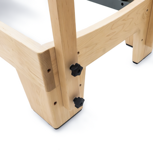 Curved Maple leg with adjustment knobs on the Oshun Studios Timber Reformer solid wood Pilates frame