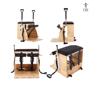 Pilates reformer machine with wooden frame and black padding on a white background