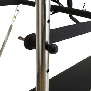 Close-up of the adjustable sliding cross bar mechanism on the Timber Cadillac Tower, featuring a quick-release locking pin for precise spring height customization.