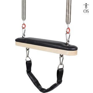Padded wooden Trapeze Swing bar featuring an adjustable black nylon foot strap and red spring connections on the Timber Cadillac.