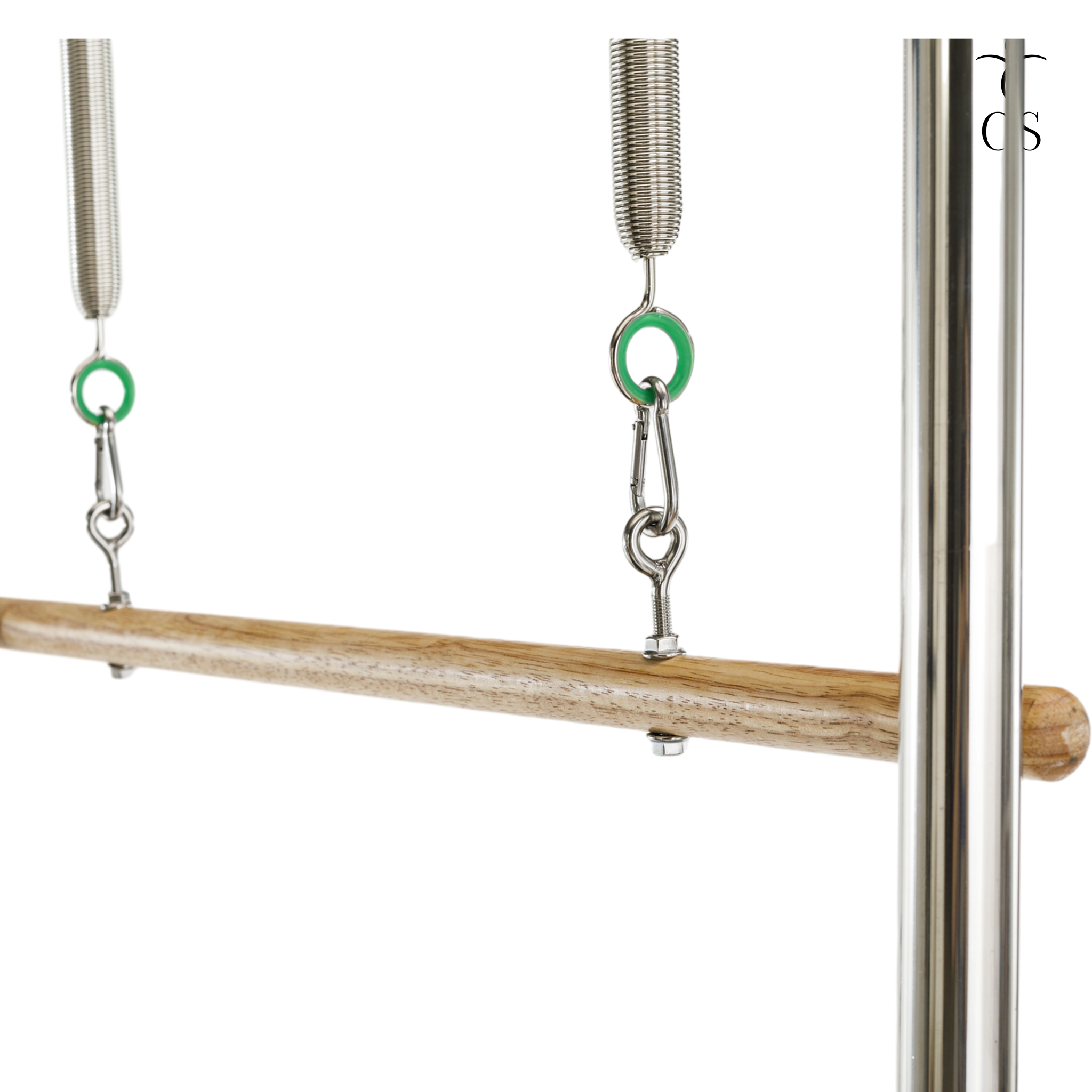 Solid wood roll-down bar attached to green resistance springs on the Timber Cadillac Tower, featuring heavy-duty carabiner connections.