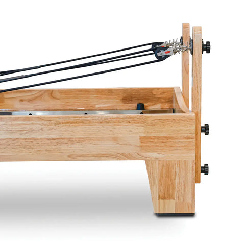 Wooden foosball table with metal rods and connectors on a white background