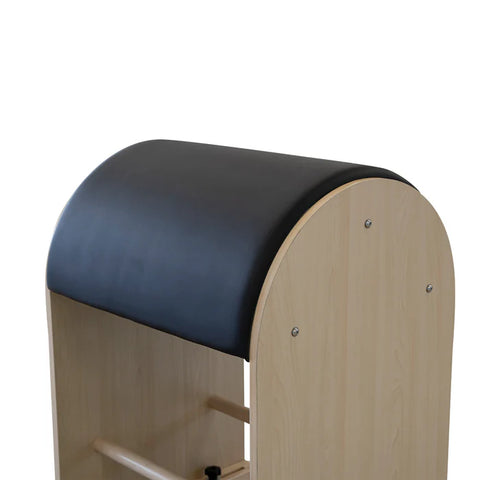 Comfortable upholstered barrel surface on the Maple Timber Ladder Barrel, designed to support the spine during advanced Pilates repertoire.