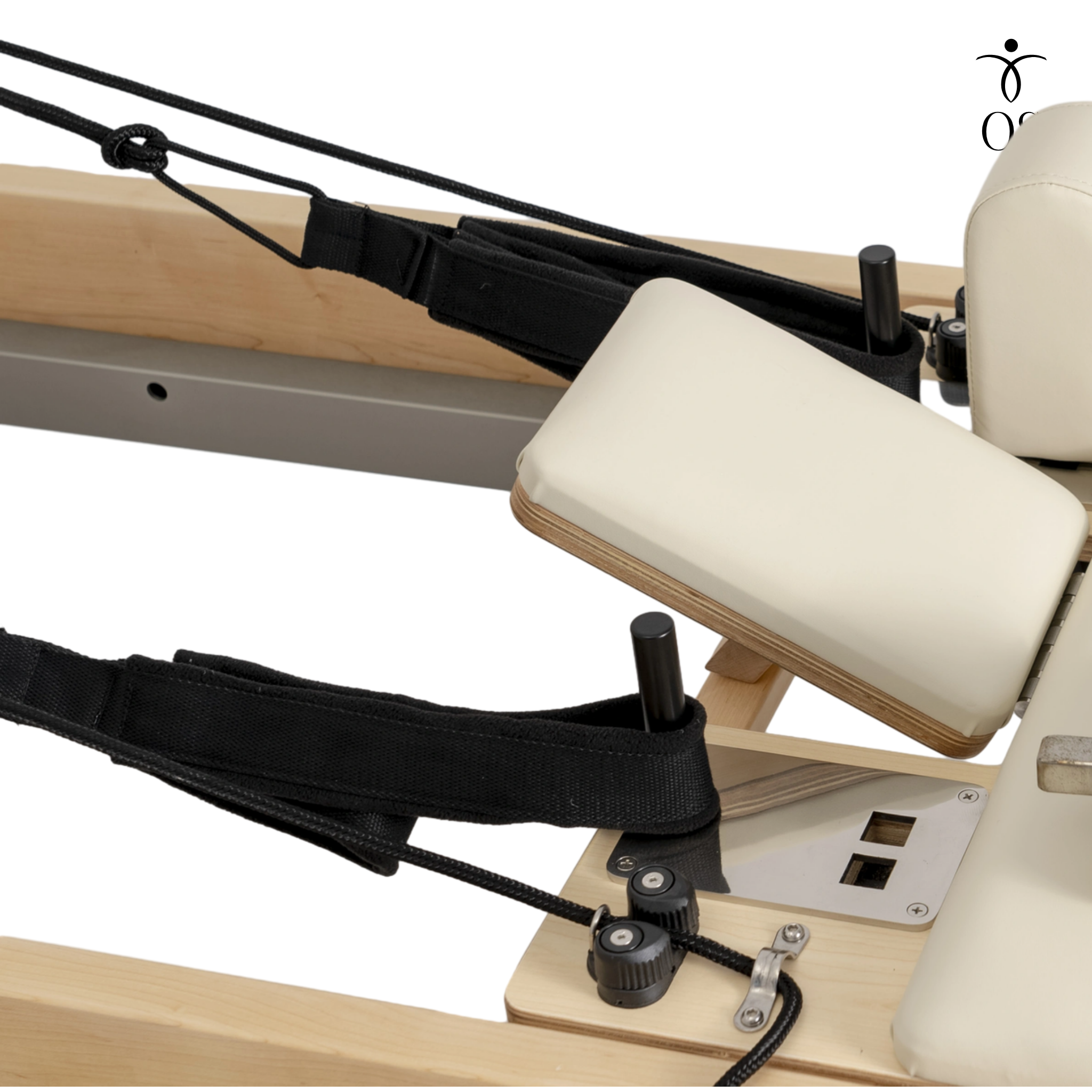 Soft touch Pilates handles and ropes on the Maple Timber Reformer, shown ready for arm and leg exercises.