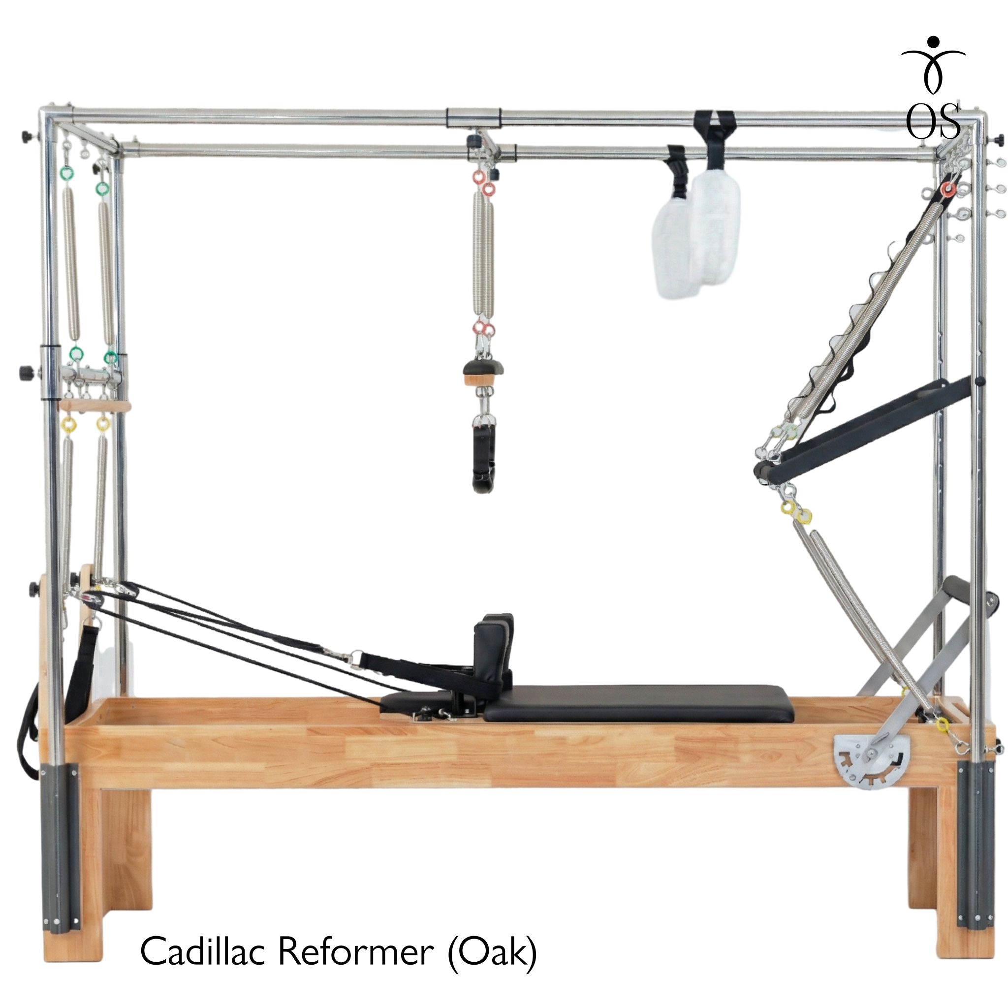 The Timber Cadillac Reformer in solid Oak. A versatile all-in-one Pilates machine combining a studio reformer with a full trapeze tower.