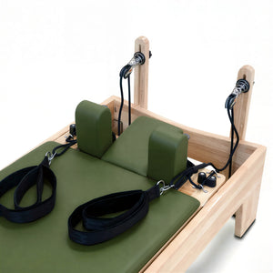 Close-up of the smooth adjustable pulley system on the solid Oak Timber Reformer by Oshun Studios.