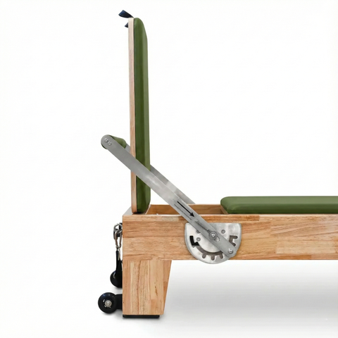 Adjustable foot bar on the Oak Timber Reformer, featuring a padded non-slip cover and multiple locking positions for versatile workouts.