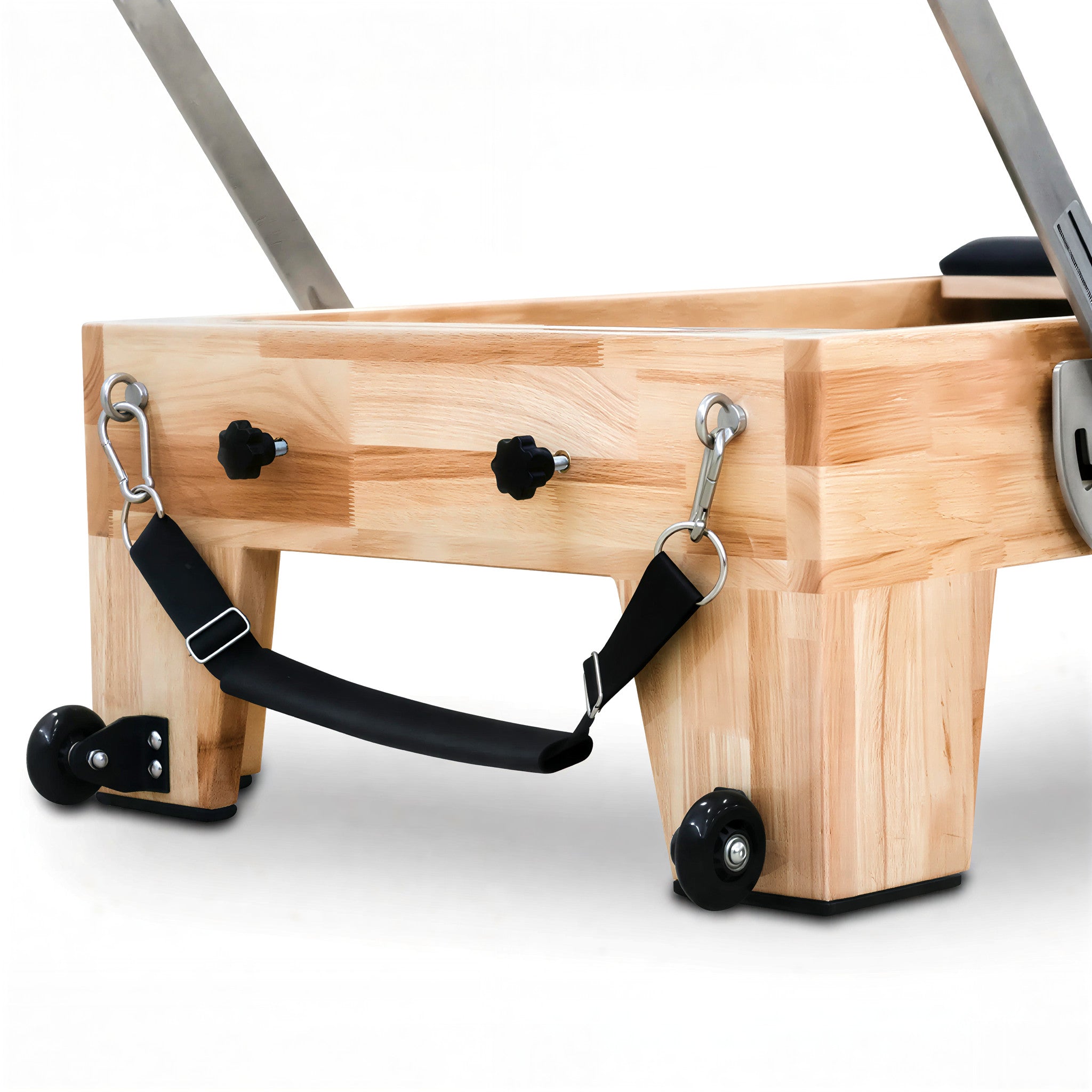 Built-in transport wheels on the base of the Oak Timber Reformer, allowing for easy movement and storage in home or studio spaces.