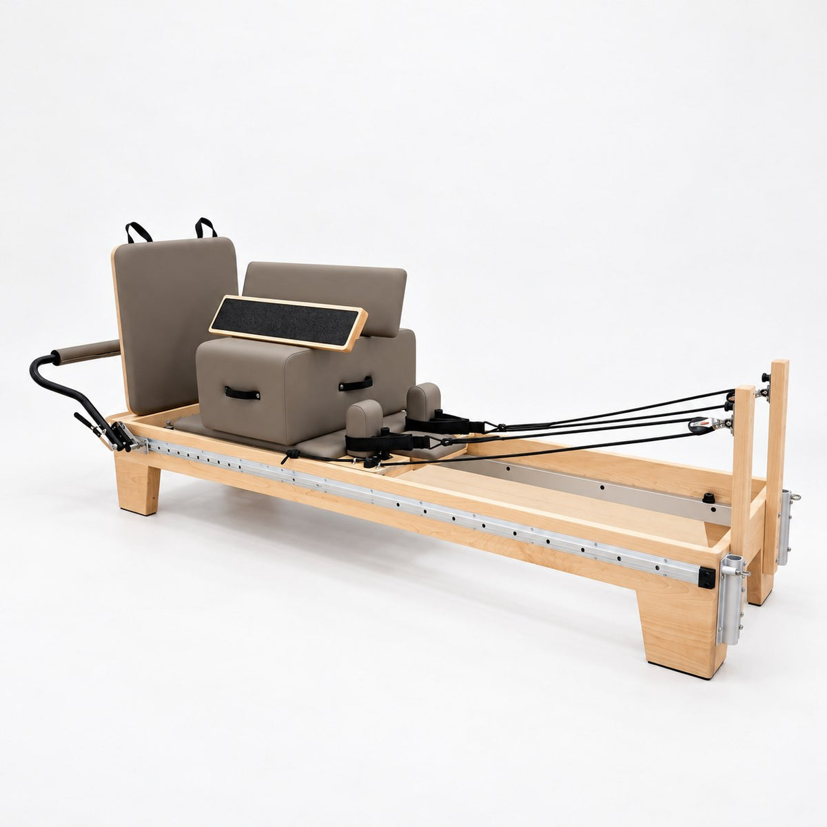 Oshun Timber Therapy Reformer in maple with taupe upholstery, sitting box and jump board