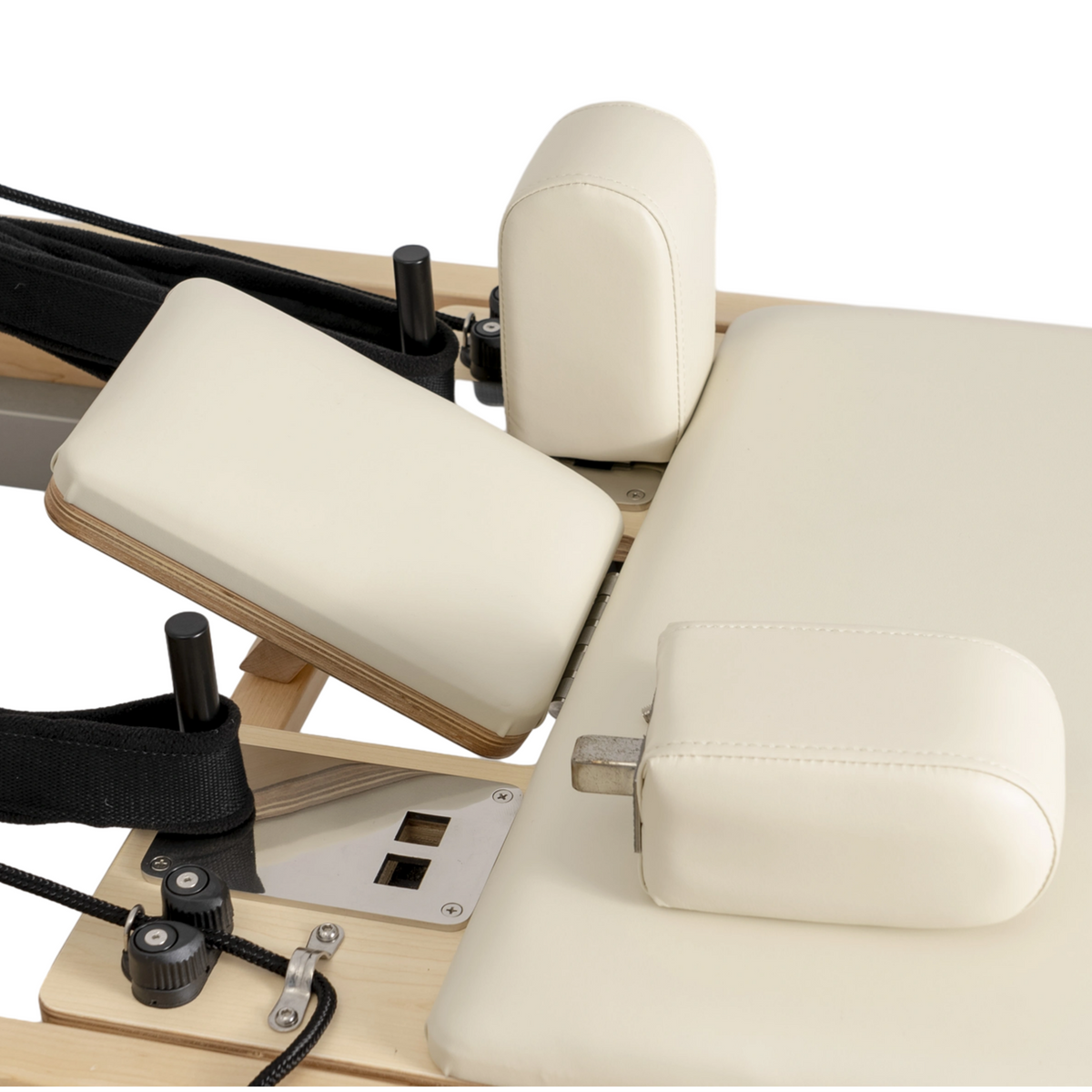 Close-up of the adjustable headrest and padded shoulder rests on the Oshun Timber Reformer