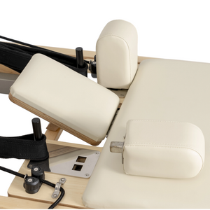 Close-up of the adjustable headrest and padded shoulder rests on the Oshun Timber Reformer