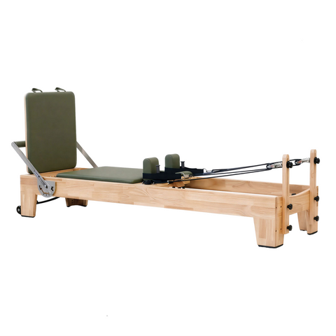 Full side profile view of the Timber Reformer in solid Oak, displaying the sleek frame design and sturdy low-profile stance.