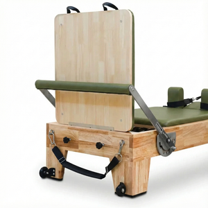 Rear view of the Oak Timber Reformer showing the handcrafted solid wood finish and riser system, designed for elegant studio aesthetics.